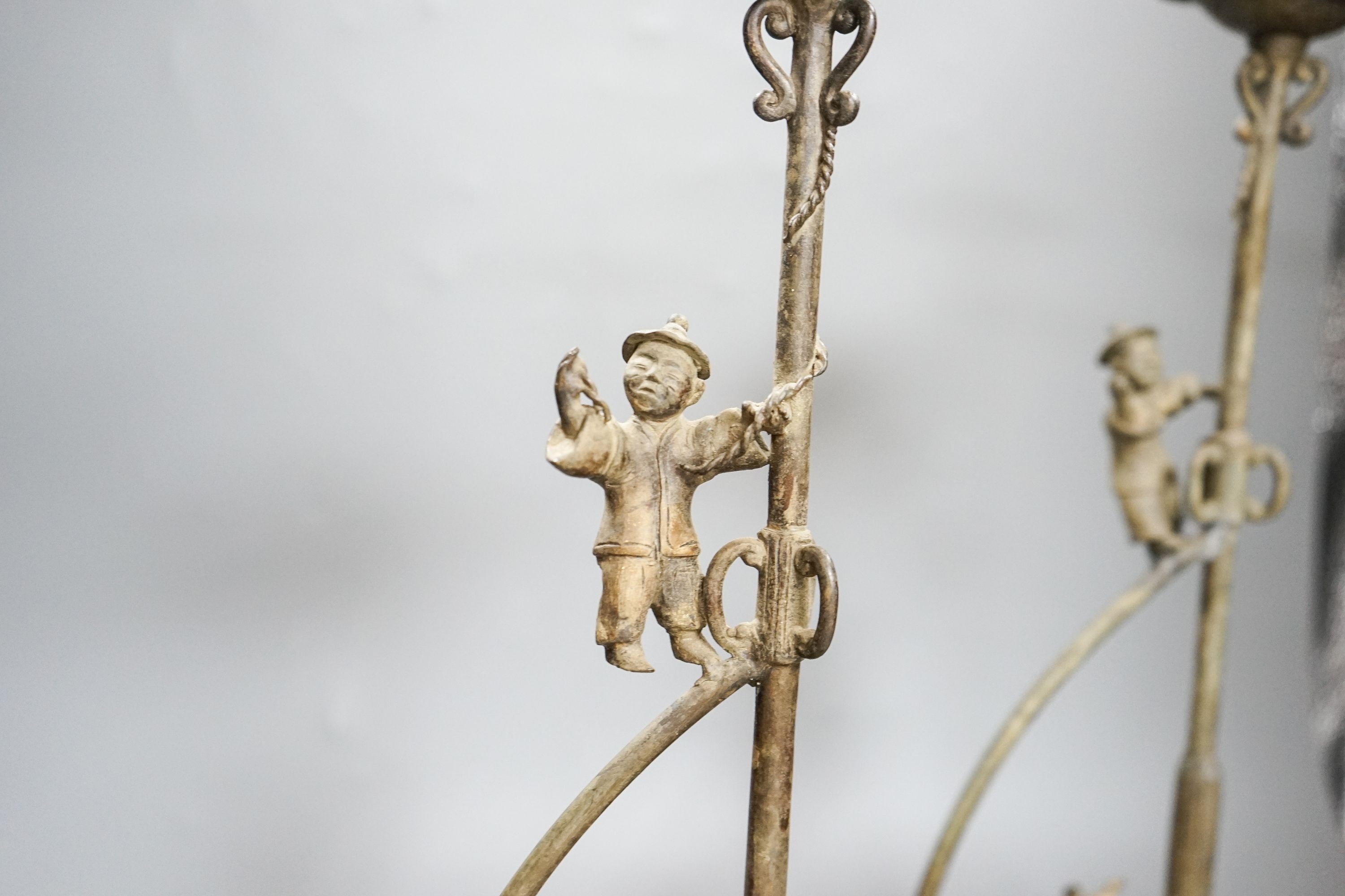 A pair of Chinese brass ‘ship’ lamp stands, 41cm